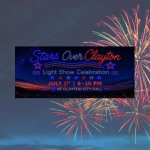 image13 - Rotary Club Of Clayton Banner for 'Stars Over Clayton' light show celebration announcing July 1, 6–10 PM at Clayton City Hall, with fireworks in the background.